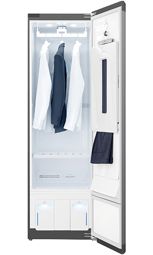 LG Styler clothes refreshing cabinet with door open and three suit jackets and shirts hanging inside