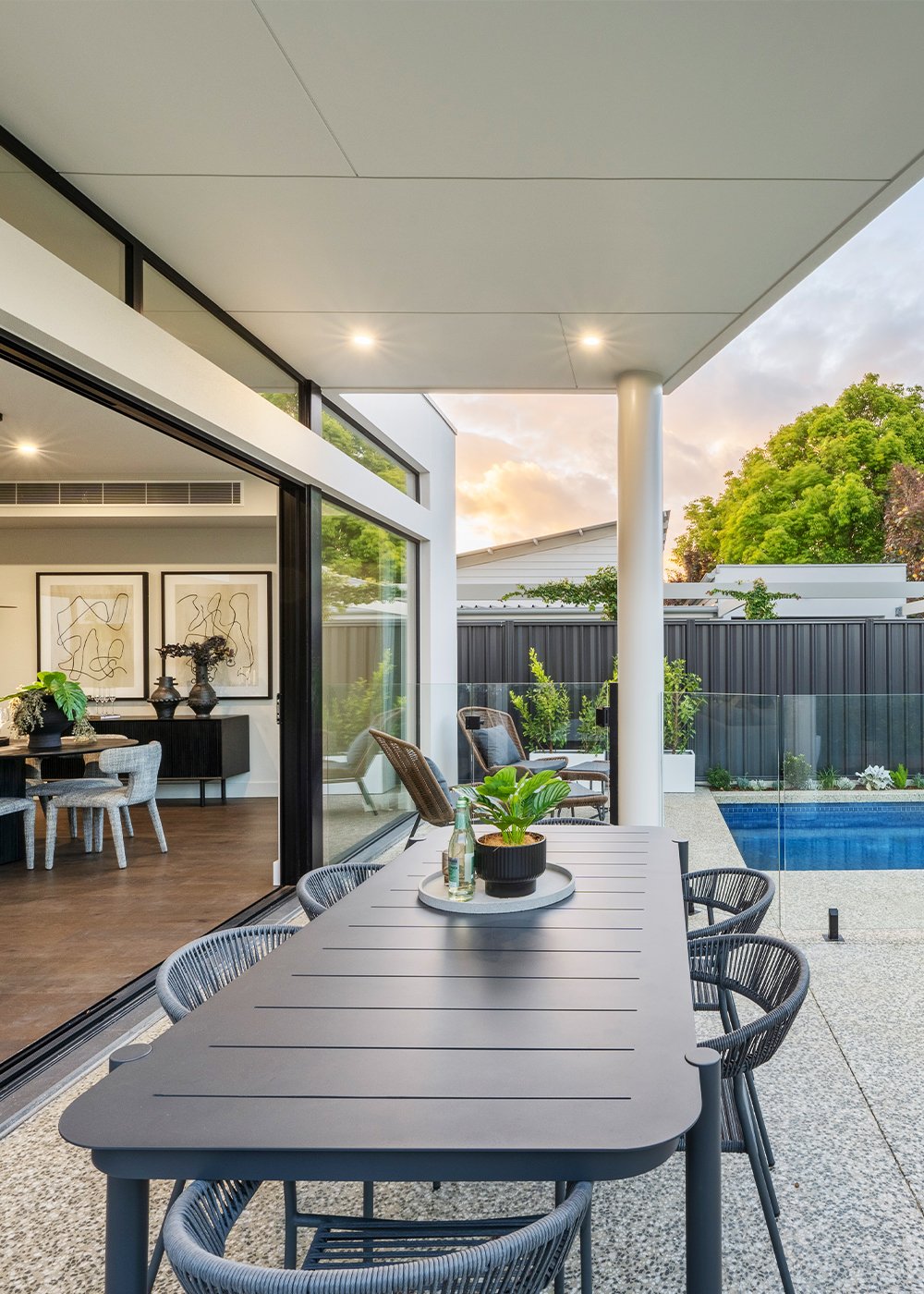 Close up detail of the outdoor entertaining area with pool beyond